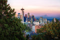 Seattle skyline at sunset with the Space Needle and Mount Rainier in the distance